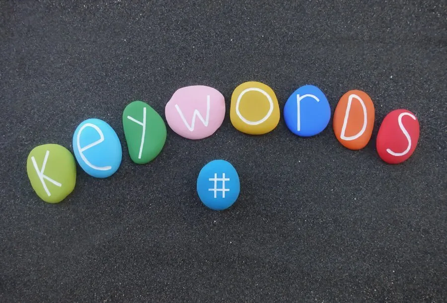 The word "keywords" written on tiny pebbles